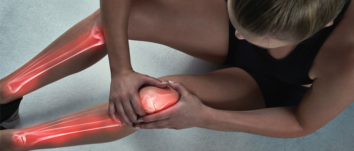 a woman with knee pain